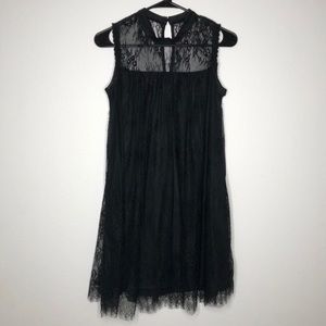 Sleeveless lace dress with high neck
